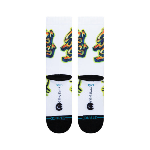 A pair of large white STANCE SHIMMY SHIMMY YA SOCKS with colorful graffiti-like patterns and black heels and toes.