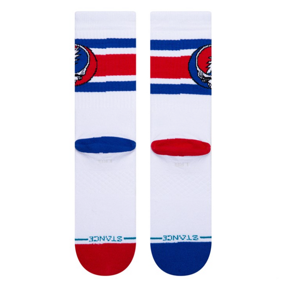 A pair of STANCE STEAL YOURE BOYD white socks with blue and red stripes and a circular logo at the top.