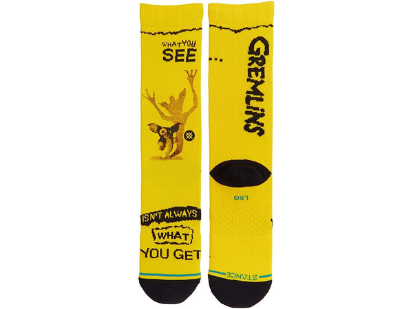 A pair of LARGE "gremlins" themed STANCE SOCKS with a graphic and text that reads "what you see isn't always WHAT YOU GET.