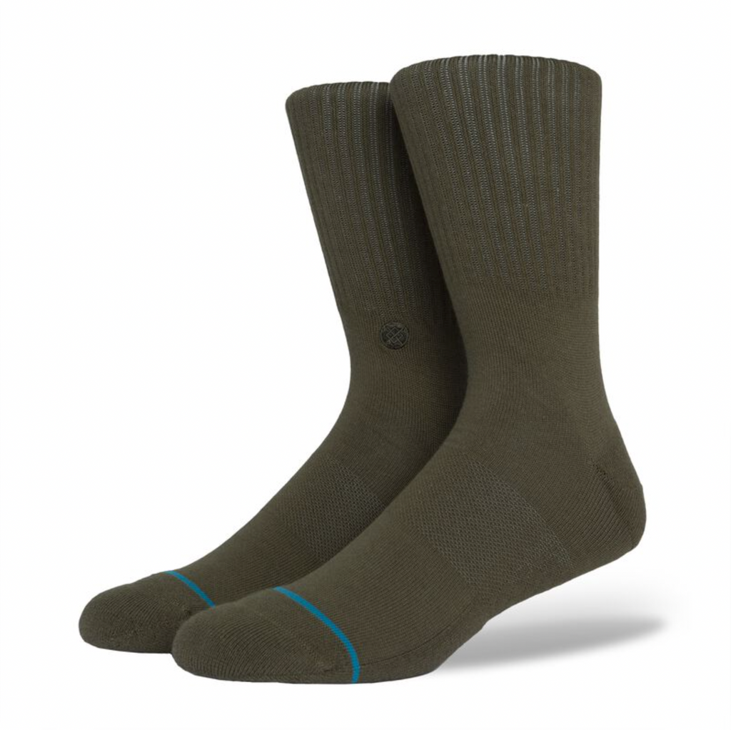 A pair of STANCE socks icon green large with a blue stripe.