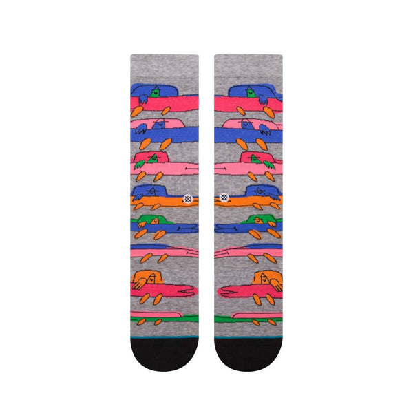 A pair of STANCE socks with a repeating airplane pattern.