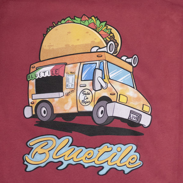 A BLUETILE MUNCHIES TACO TRUCK T-SHIRT CAYAN featuring a taco truck.