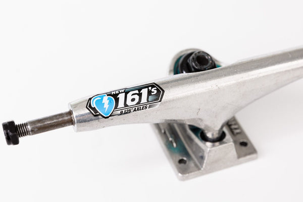 A silver THUNDER TRUCKS 161 POLISHED (SET OF TWO) skateboard truck on a white background.