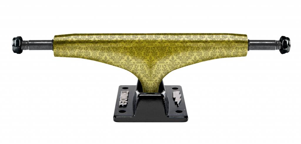 A yellow and black THUNDER skateboard truck on a black background.