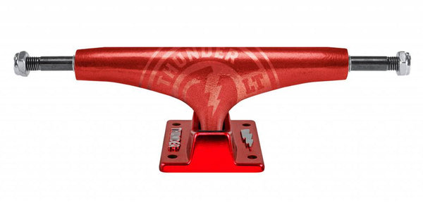A THUNDER skateboard truck with THUNDER HOLLOW LIGHTS STRIKE RED 147 HI hanger on a white background.