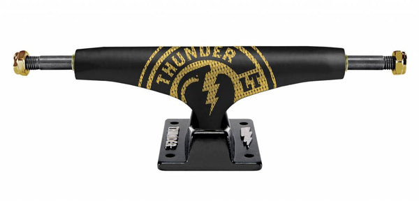 A black and gold THUNDER truck with the word thunder on it.