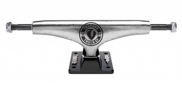 A black and silver THUNDER TRUCKS LTD LIGHTS (SET OF TWO) skateboard truck on a white background.