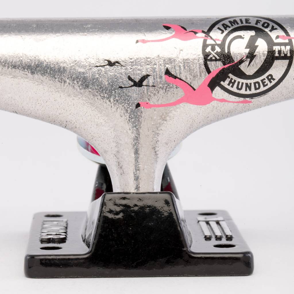 A THUNDER TRUCKS JAMIE FOY SKY HIGH (SET OF TWO) skateboard truck with a flamingo on it.