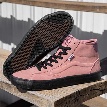 VANS THE LIZZIE ROSETTE pink high top sneakers on a wooden bench, endorsed by LIZZIE ROSETTE.