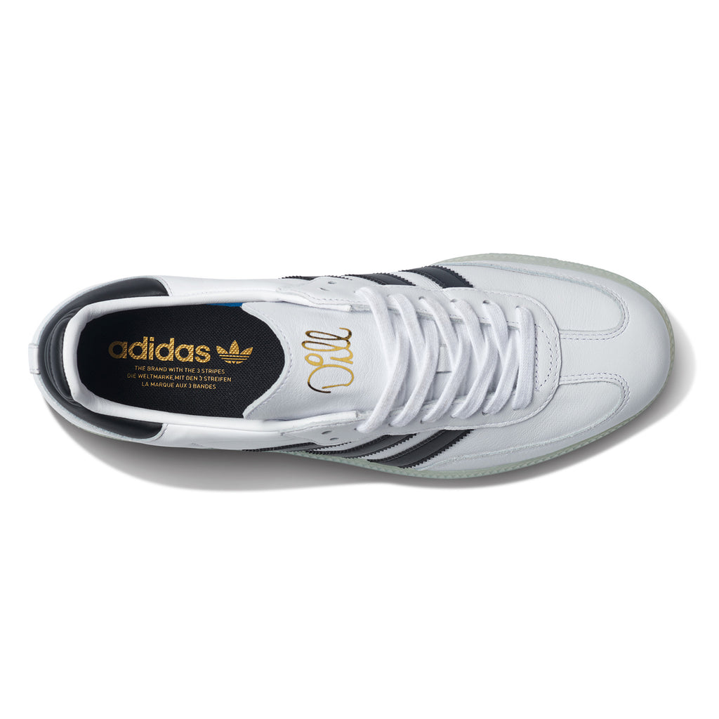 Modified Description: A white and blue ADIDAS JASON DILL SAMBA sneaker with a gold logo.