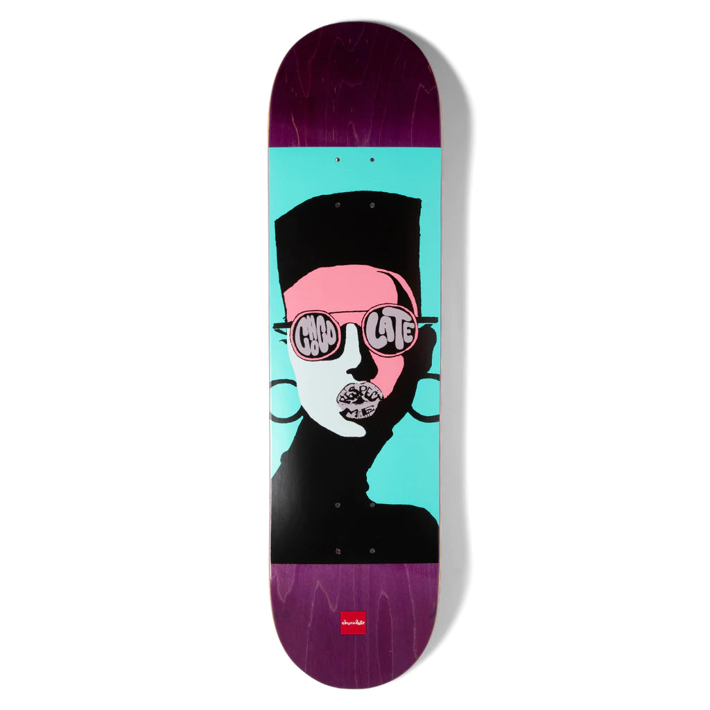 A CHOCOLATE skateboard with a picture of a person wearing sunglasses.