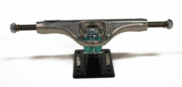 A THUNDER skateboard truck on a white background.