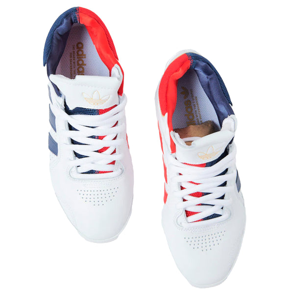 A pair of ADIDAS TYSHAWN WHITE / COLLEGIATE NAVY / GOLD sneakers with Tyshawn signature accents.