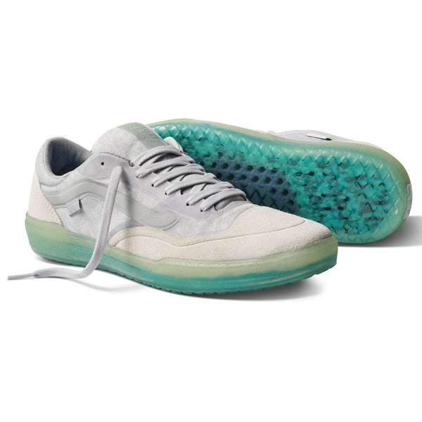 A pair of white VANS AVE PRO BEATRICE DOMOND BONEJADE sneakers with green soles.