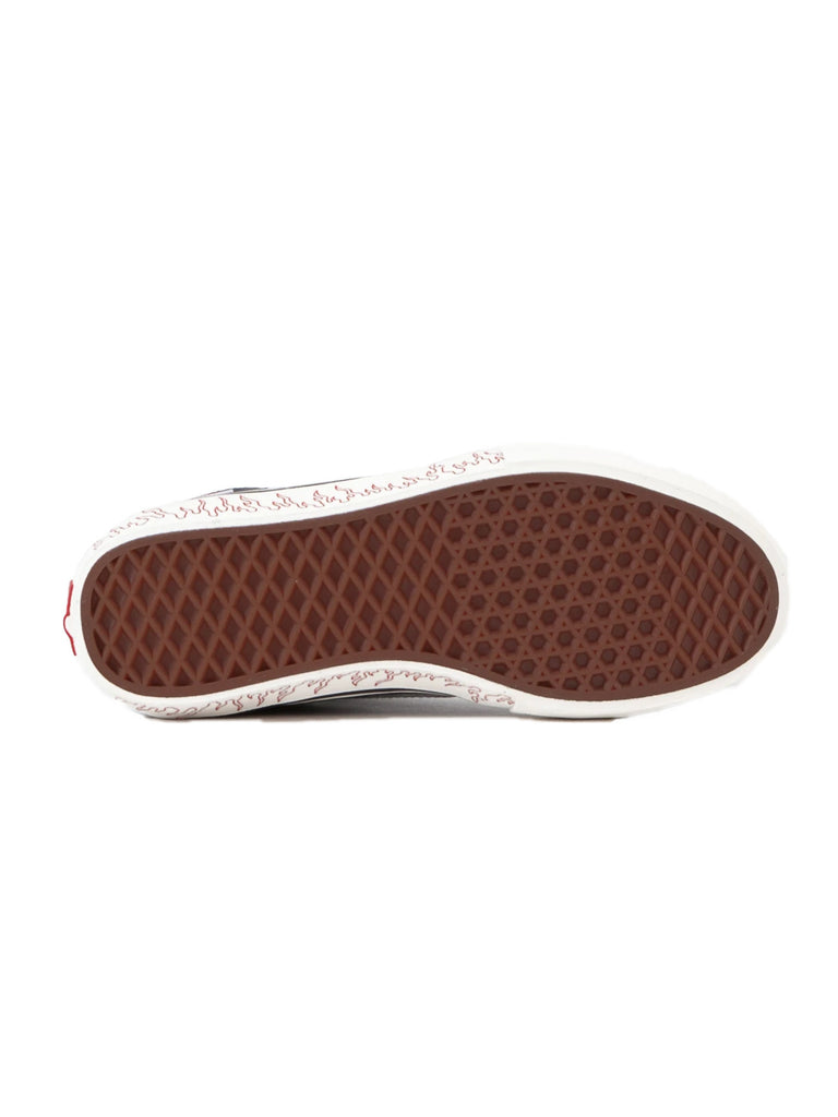 A pair of VANS X LOTTIES SK8-HI PRO LTD BLU/BLK slip-on shoes with a brown sole.
