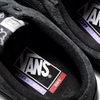 A pair of black VANS x CULT BMX Old Skool sneakers with a purple logo.