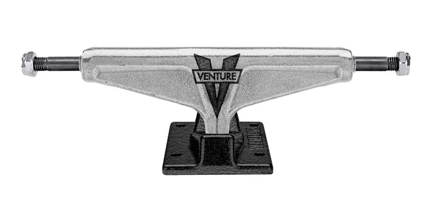An image of a VENTURE CALEB AWAKE POLISHED HI 5.2 skateboard truck on a white background.
