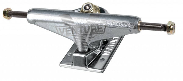 A VENTURE skateboard truck on a white background.