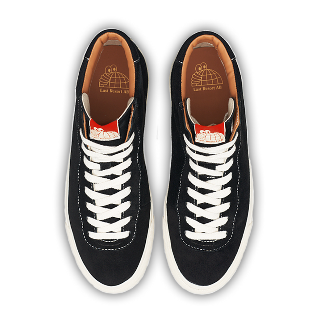 A pair of LAST RESORT AB VM001 HI SUEDE BLACK/WHITE sneakers. These Last Resort AB sneakers are perfect for those who like a sleek and minimalist design. The contrasting black and white color scheme adds a touch of sophistication to any outfit.