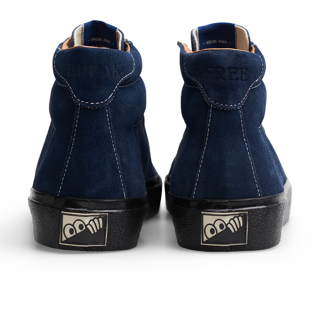 The back view of a pair of Last Resort AB navy/black suede sneakers.