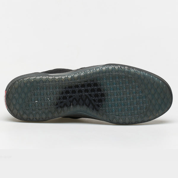 The sole of a black VANS AVE PRO BLACK / SMOKE shoe on a white surface.