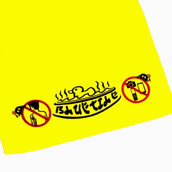 A yellow t-shirt with a no smoking sign on it and a Bluetile Skateboards rubber ducky.